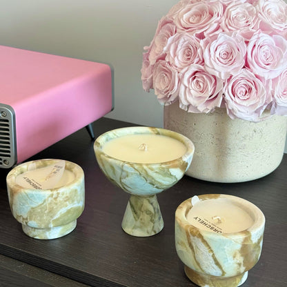 A bouquet of light pink preserved roses in a yellow travertine container serves as a charming centerpiece. It adds a touch of natural elegance and soft color to the space, effortlessly enhancing the overall decor with its long - lasting beauty.